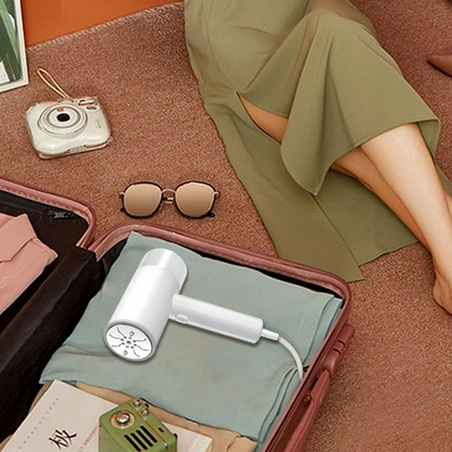 Défroisseur portatif pour vêtements